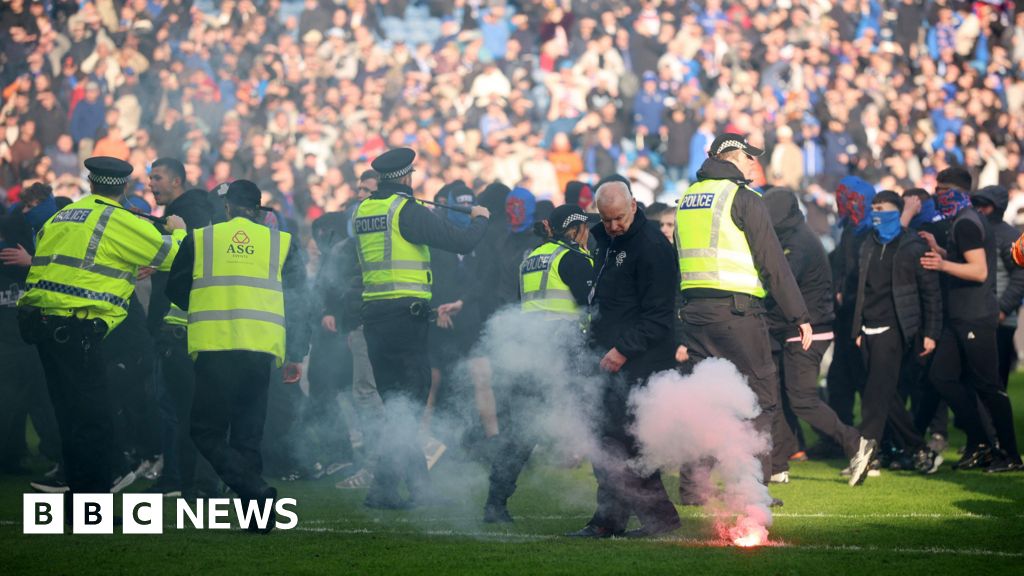 Police separate Celtic and Rangers fans after Ibrox pitch invasion